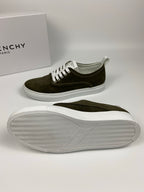 Olive suede sneakers with white laces; outsole sole view shows textured tread.