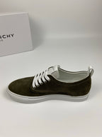 Olive suede sneaker with white laces and white rubber sole, front side view.