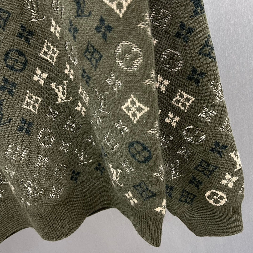 Close-up of long-sleeve sweater knit with LV monogram and geometric motifs