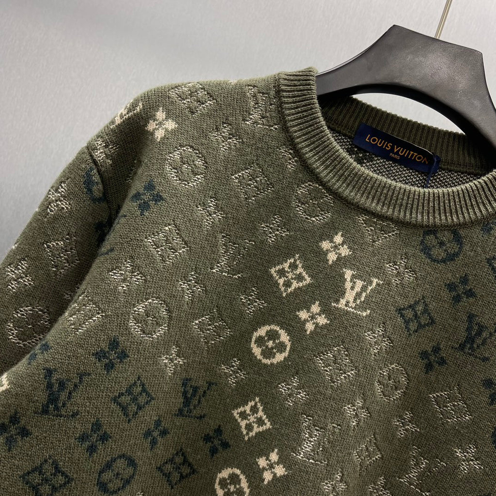 Long-sleeve sweater knit close-up with ribbed crew neck and repeating Louis Vuitton logo