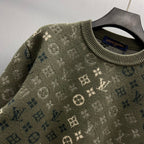 Long-sleeve sweater knit close-up with ribbed crew neck and repeating Louis Vuitton logo