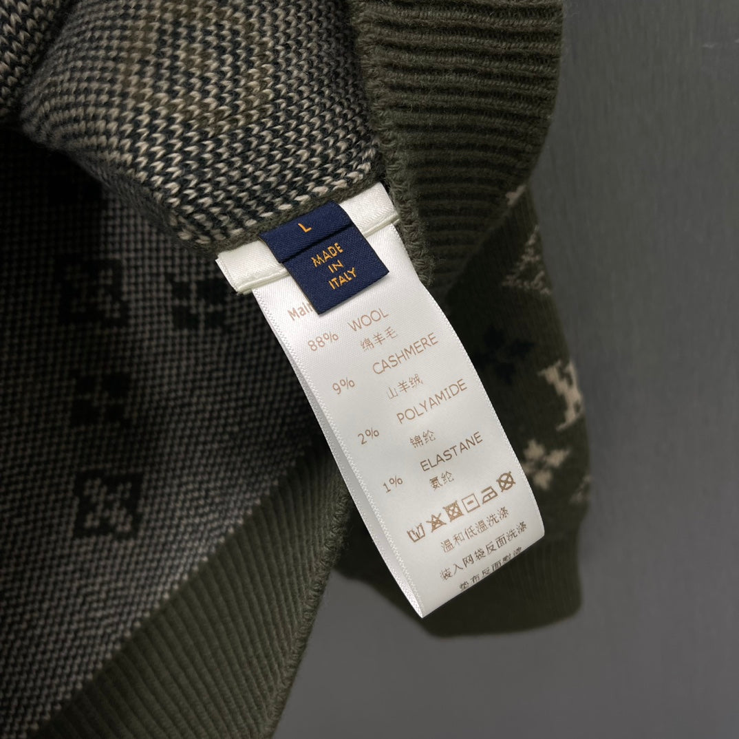 Clothing care label on knit sweater listing fiber blend including cashmere and elastane