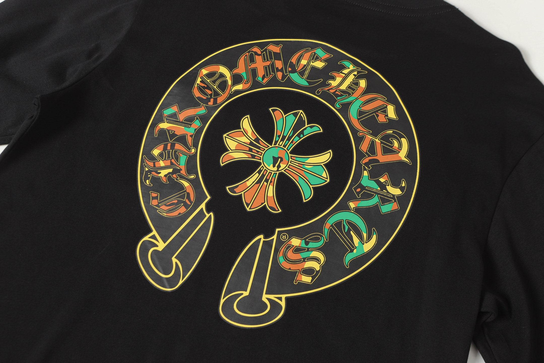 Black long-sleeve shirt close-up of large circular back graphic with character illustration