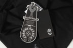 Black long-sleeve top with white crest patch on hang tag