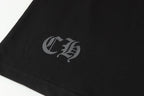 Black long-sleeve shirt sleeve cuff with small gray monogram emblem