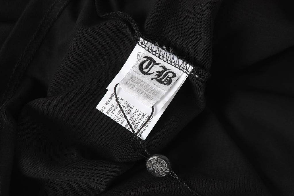 Black long-sleeve shirt fabric with white interior neck label and care tag