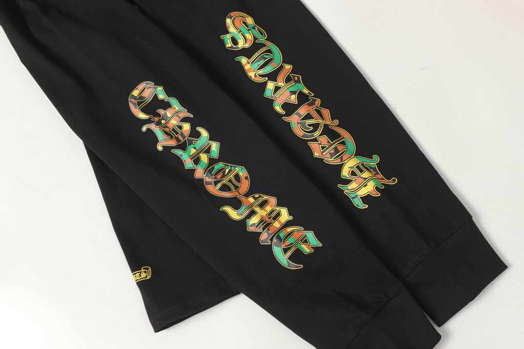 Black long-sleeve shirt sleeve graphic artwork, shown in a close crop