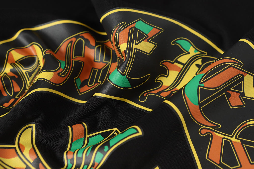Black long-sleeve top with colorful graffiti-style logo print