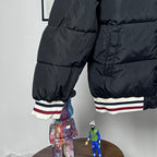 Moncler quilted puffer jacket with striped cuffs and stitched paneling