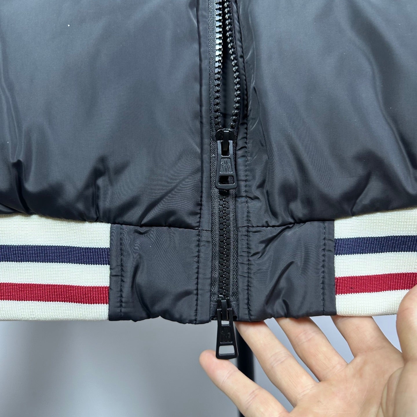 Moncler puffer jacket zip front with black zipper and striped ribbed band
