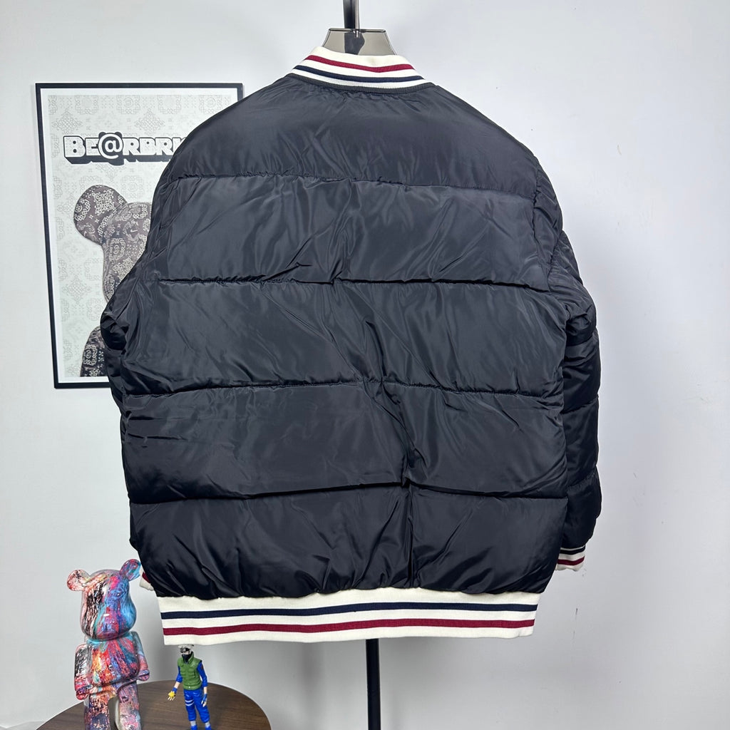 Moncler quilted puffer jacket, back view, with striped ribbed hem