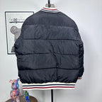 Moncler quilted puffer jacket, back view, with striped ribbed hem