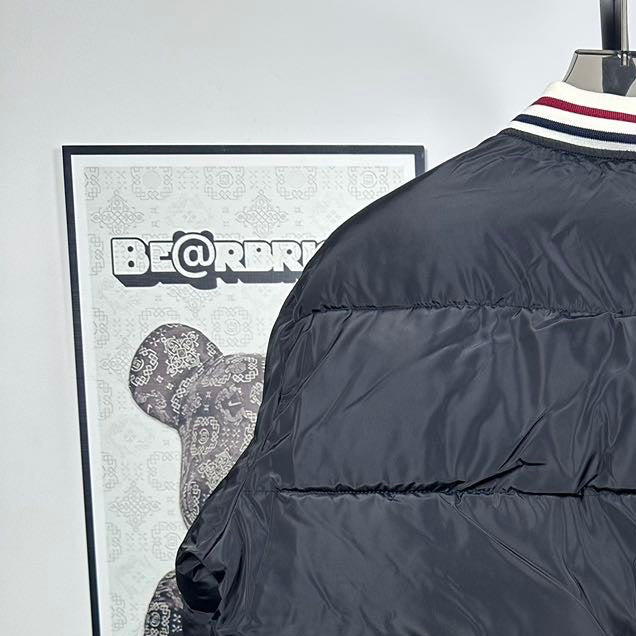 Moncler long puffer jacket, black quilted front and zipper with striped trim cuff