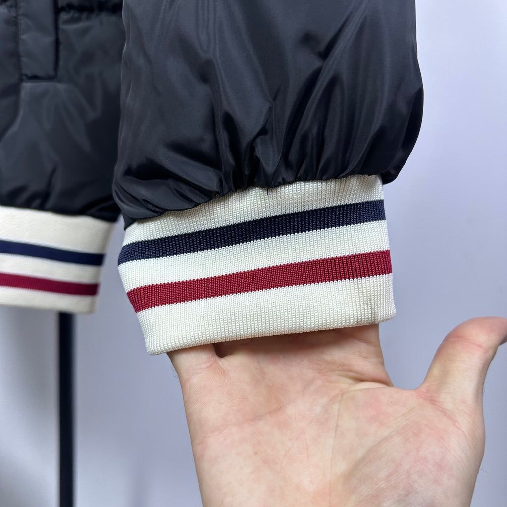 Moncler puffer jacket sleeve with striped ribbed cuff