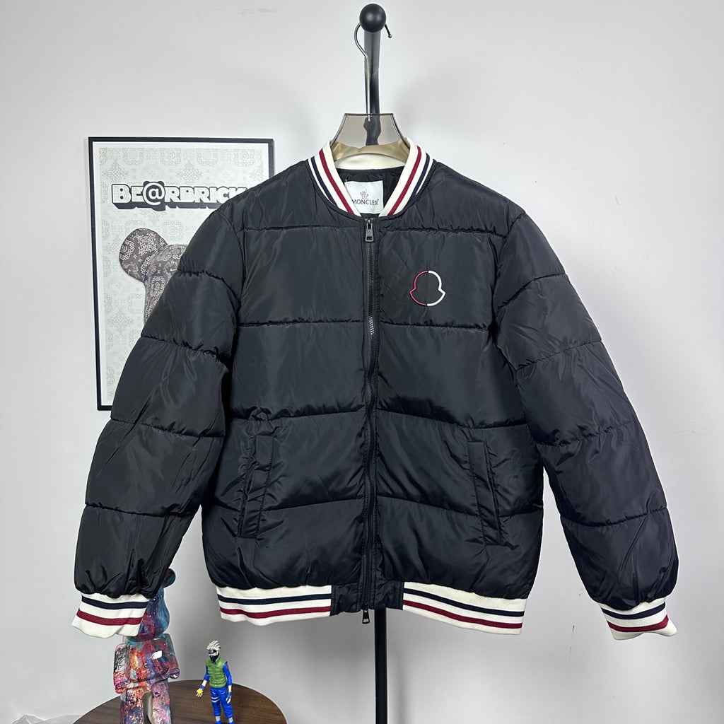Moncler quilted puffer jacket with zip front and striped ribbed cuffs