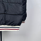 Moncler long puffer jacket, black quilted front panel and striped hem