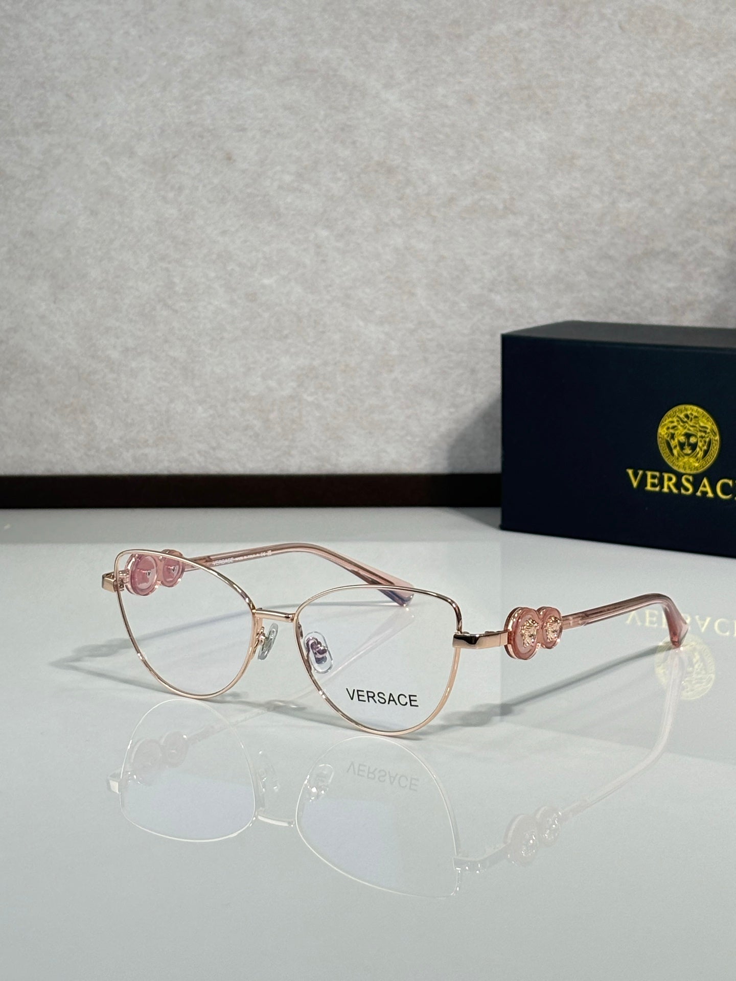 Versace aviator eyeglasses with rose-gold frame and clear lenses
