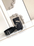 Fendi crossbody bag with exposed zipper and black web shoulder strap