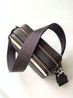 Leather mini crossbody bag with double zip and wide webbing strap; metal hardware