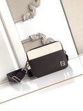 Fendi bag with textured leather, two-tone front, top zip, and shoulder strap