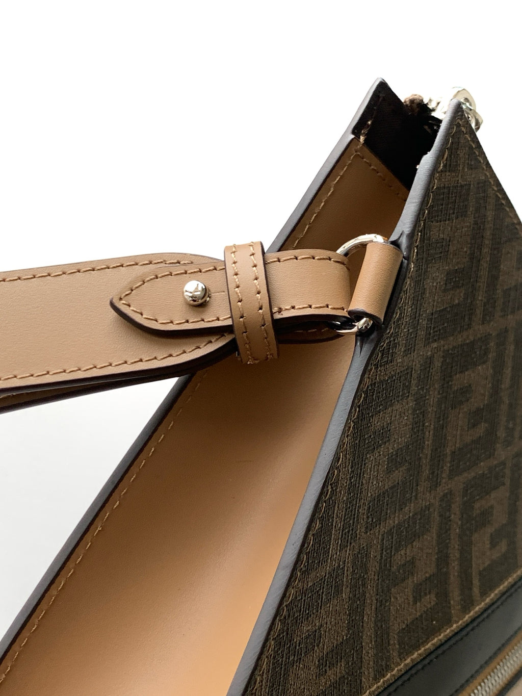 Fendi clutch bag close-up of tan leather strap with metal snap and logo panel