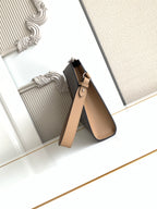 Fendi logo clutch bag with tan leather strap and metal zip pull