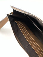 Fendi clutch bag open view with black interior and zipper top edge