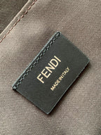 Fendi Made in Italy logo label on gray fabric