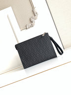 Fendi bag with dark logo pattern, black wrist strap, and zip top