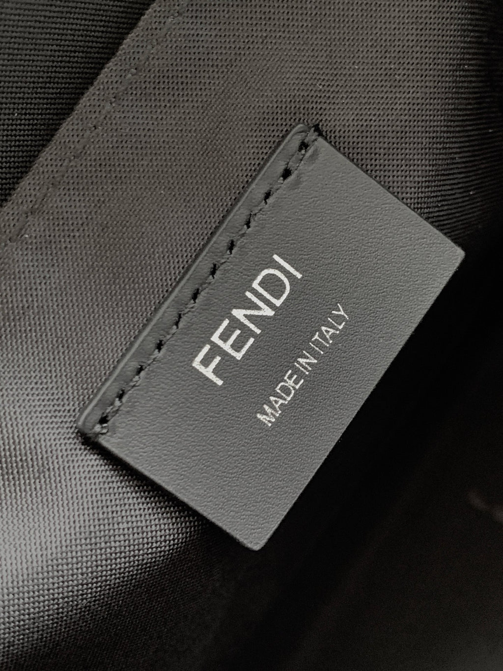 Fendi bag fabric label reading FENDI MADE IN ITALY