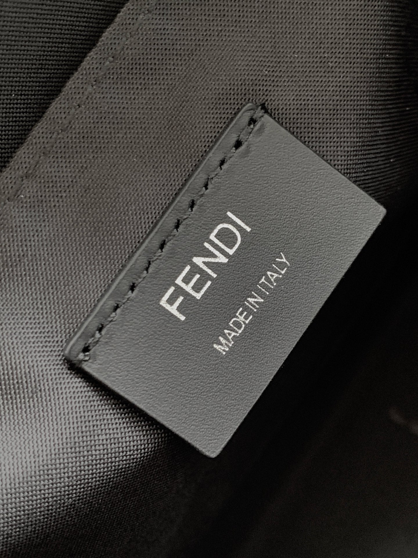 Fendi bag fabric label reading FENDI MADE IN ITALY
