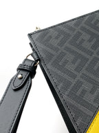 Fendi bag strap attachment in dark leather on textured fabric