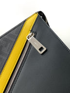 Fendi bag zip close-up with silver hardware and yellow side trim