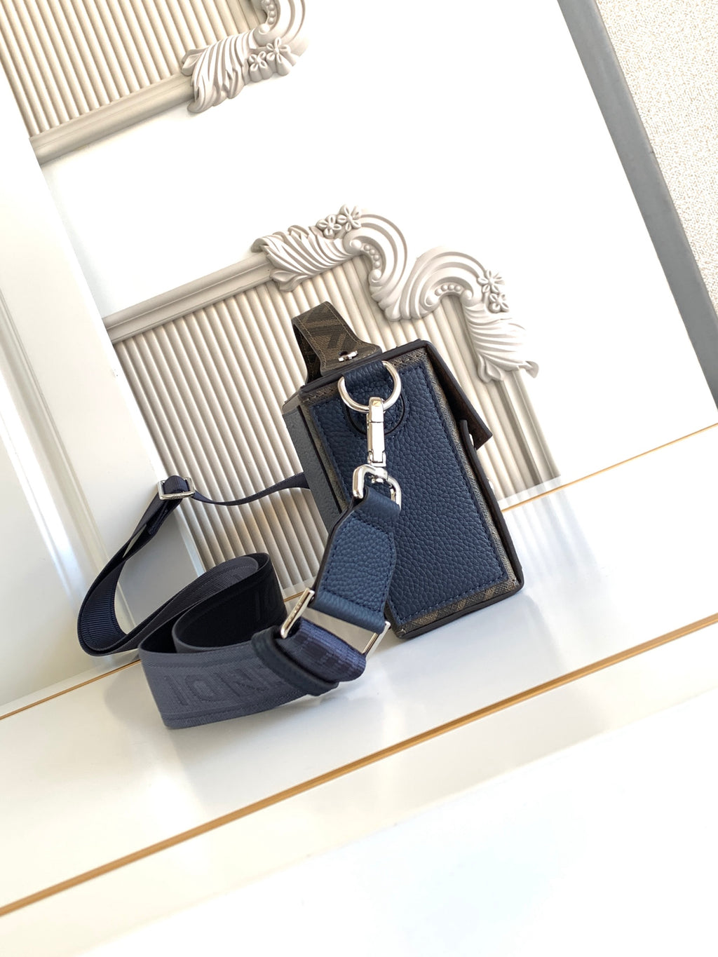 Fendi small crossbody bag with flap, blue leather exterior, adjustable strap and key charm