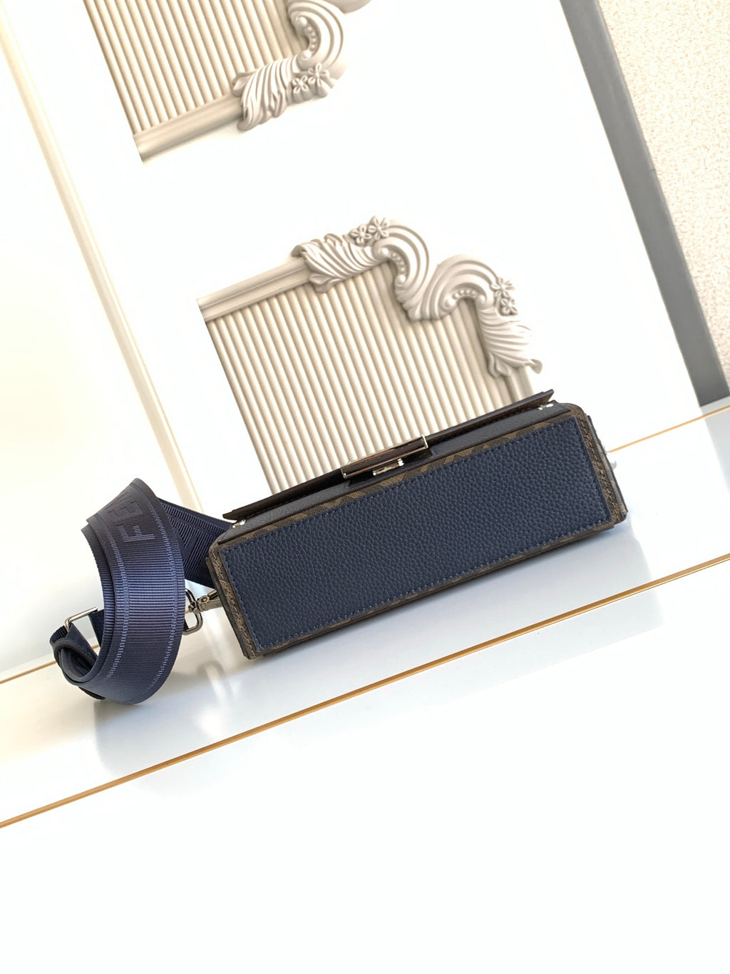 Fendi small crossbody bag, blue pebbled leather flap with gold-tone edge hardware and strap