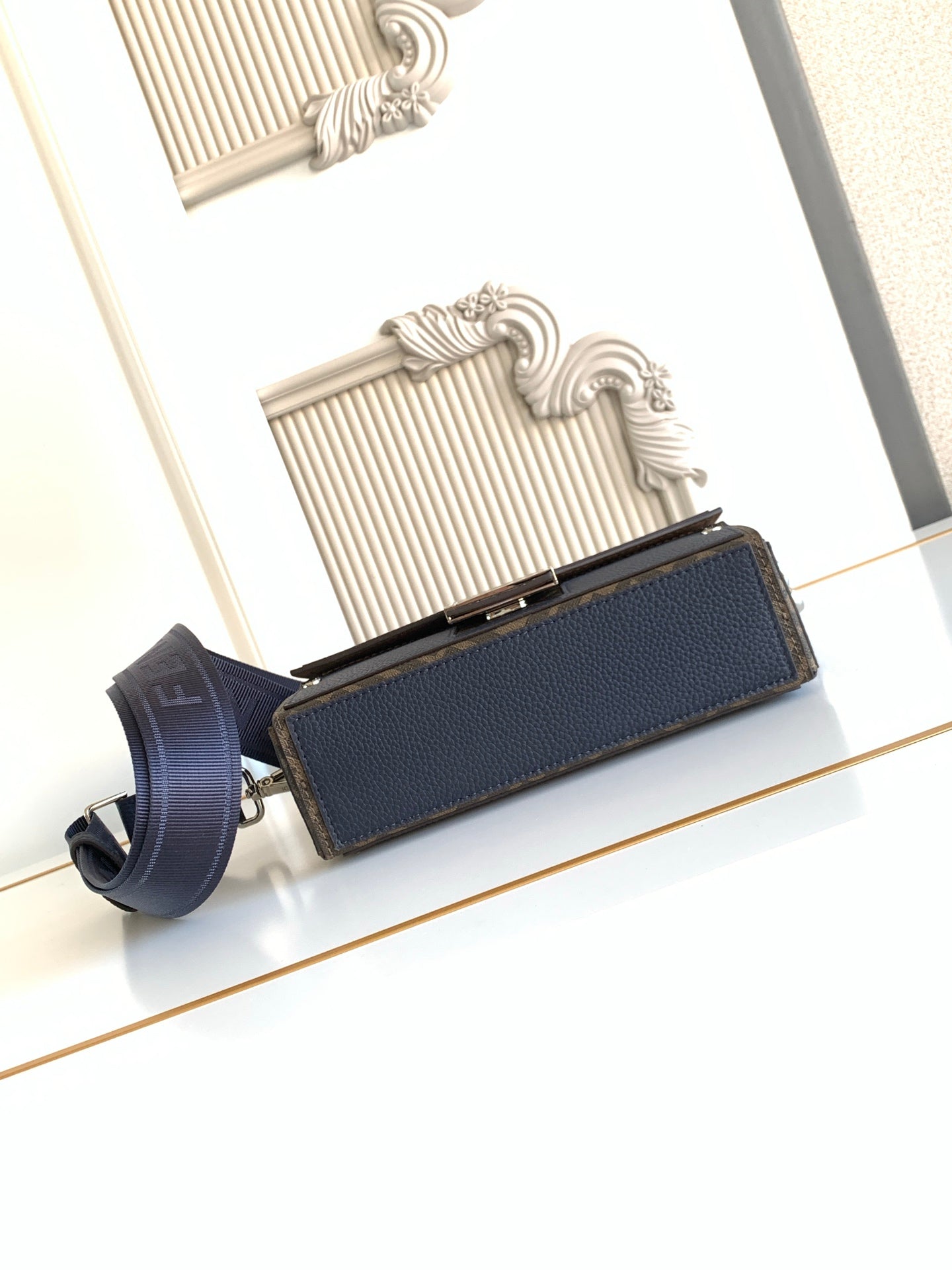 Fendi small crossbody bag, blue pebbled leather flap with gold-tone edge hardware and strap
