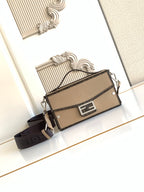 Fendi mini crossbody bag in textured beige with black strap and front logo lock