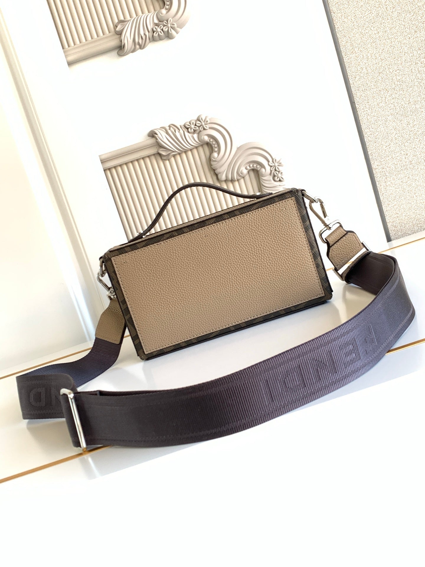 Fendi flap crossbody bag in textured beige with navy web strap and top side closure