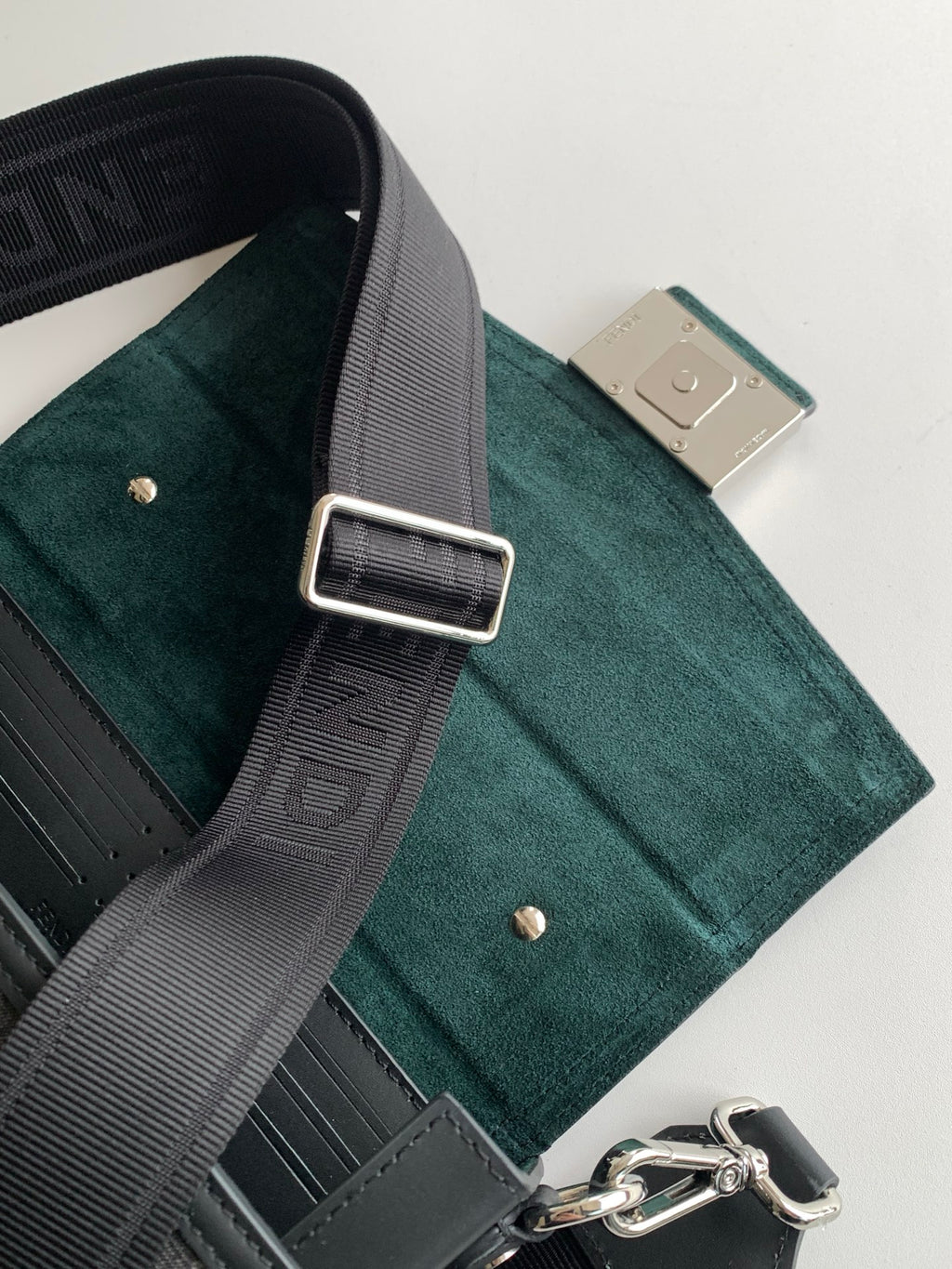 Fendi mini bag interior pocket and adjustable strap, teal suede and dark trim