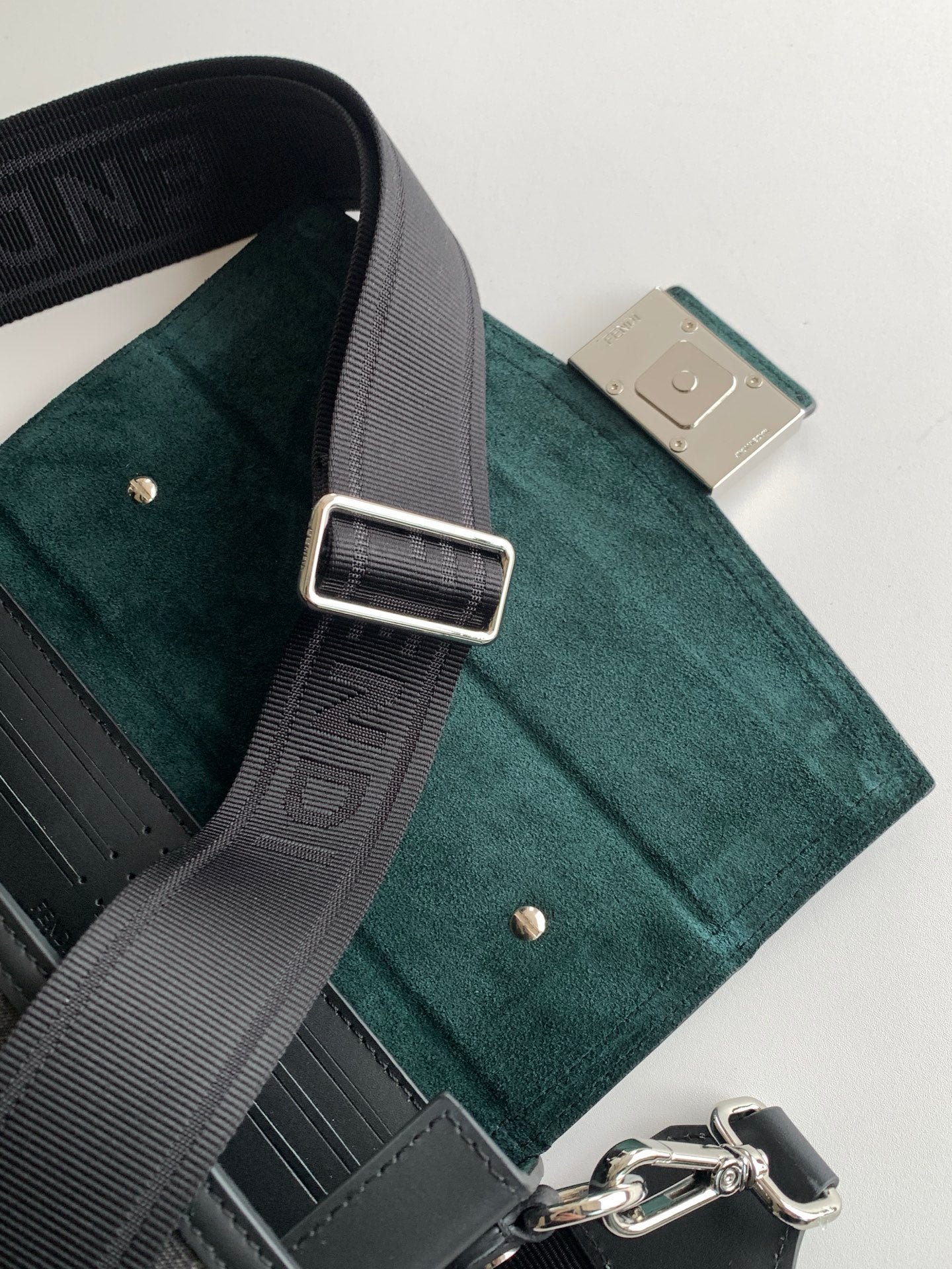 Fendi mini bag interior pocket and adjustable strap, teal suede and dark trim