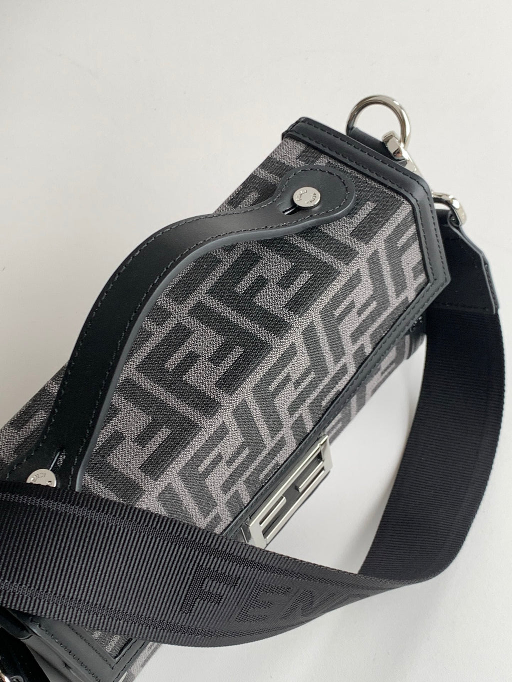 Fendi monogram crossbody bag side view with top handle and strap