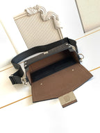 Fendi bag open view showing brown lining, top clasp, and adjustable crossbody strap