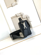 Fendi bag with black body, front clasp hardware, and leather crossbody strap