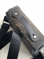 Fendi bag close-up of logo canvas with light gray leather tab and silver rivets