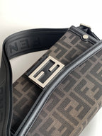 Fendi bag strap detail with dark logo webbing and silver-tone buckle hardware