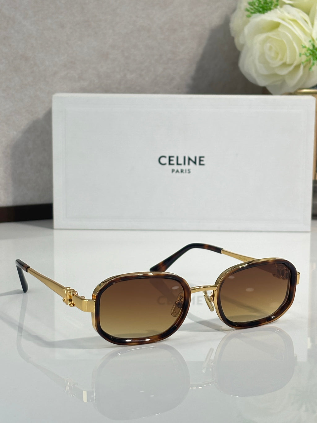 Tortoise-brown sunglasses with brown tinted lenses, angled side view