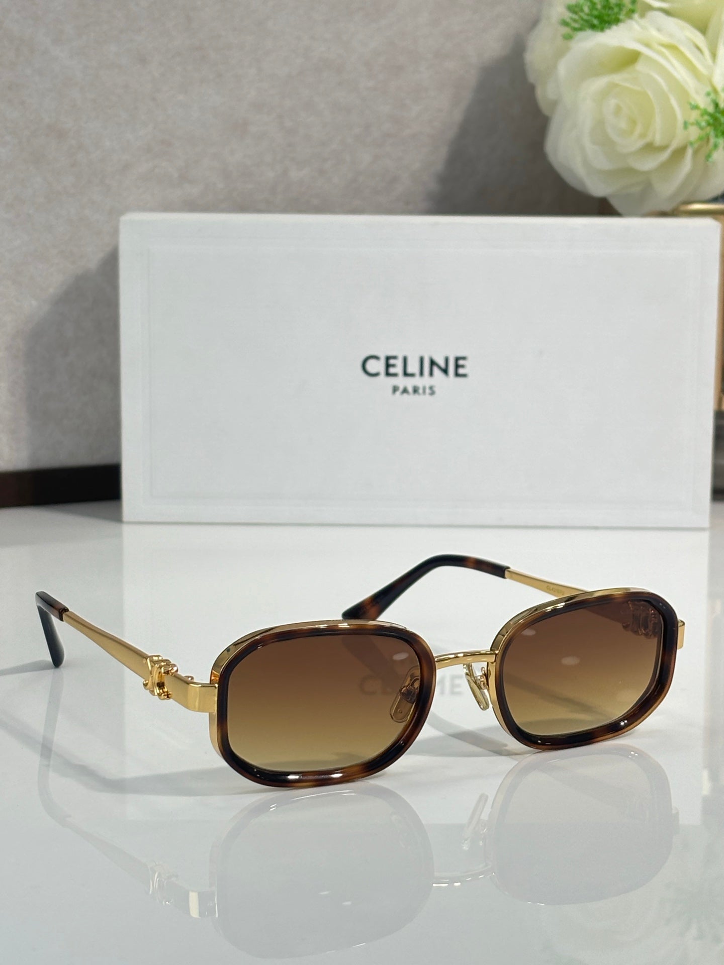 Tortoise-brown sunglasses with brown tinted lenses, angled side view