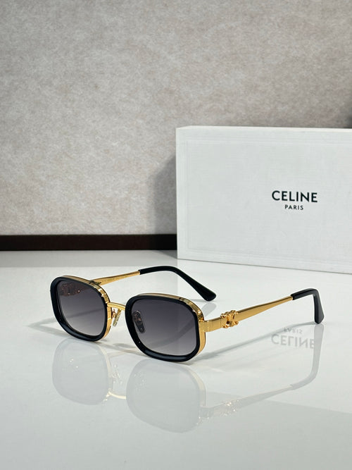 Celine sunglasses with black frames, gold accents, and dark tinted lenses