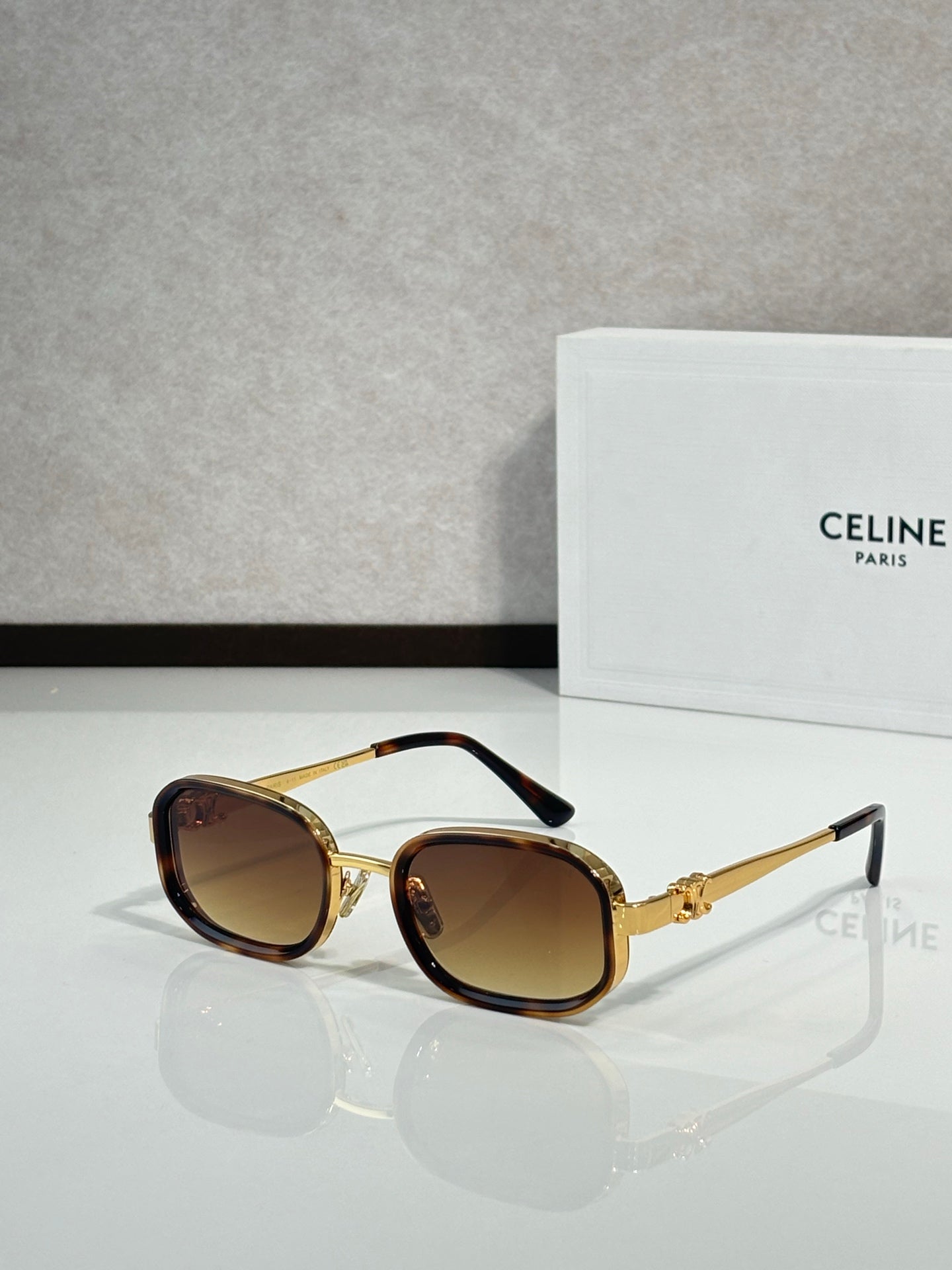 Gold sunglasses with brown tinted lenses, round-square lenses