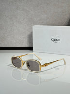 Cream and gold sunglasses with dark tinted lenses, round-square shape